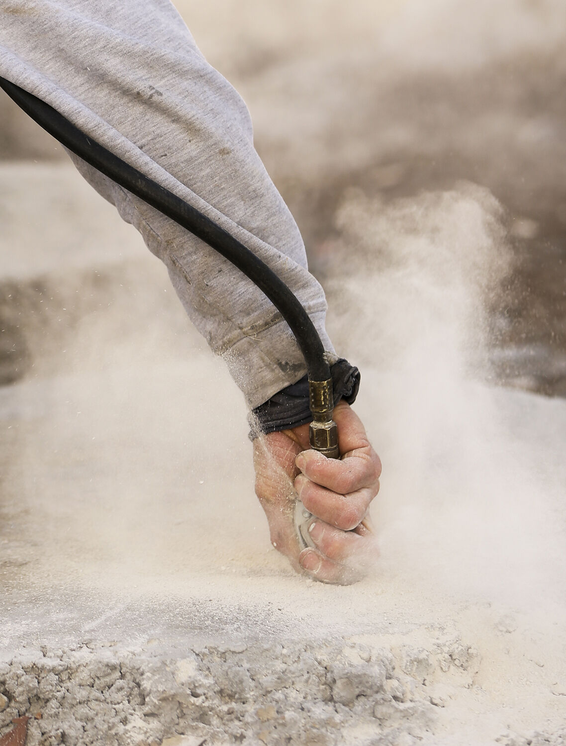 Using compressed air, the extra sand and ground concrete was blown out